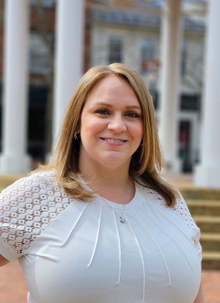 Sara Jones in a white blouse in front of the Front Royal gazebo.